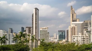 Bangkok, Thailand - 13 January 2023 - Time lapse view of Bangkok high-rises  on cloudy day with white clouds moving across the sky