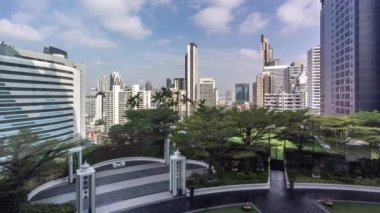 Bangkok, Thailand - 13 January 2023 - Time lapse view of Bangkok high-rises  on cloudy day with white clouds moving across the sky