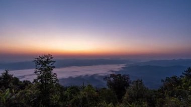 Time lapse view of beautiful morning sunrise with moving clouds above Doi Luang Chiang Dao landscape in Chiang Mai, Thailand