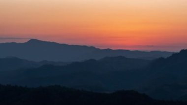 Time lapse view of beautiful morning sunrise with moving clouds above Doi Luang Chiang Dao landscape in Chiang Mai, Thailand
