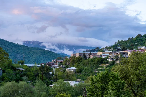 stock image Dilijan, Armenia - 15 May 2023 - Night view of the hospital buildings against mountains and cloudy sky in Dilijan, Armenia