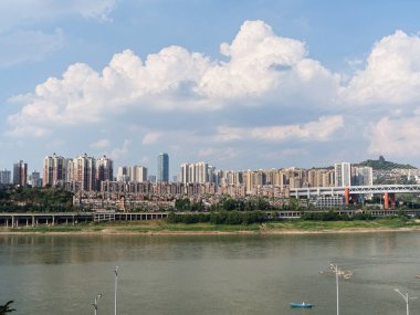 This photo was taken in Chongqing, China on August 28th, 2024. It showcases the scenery along the Jialing River, modern high-rise buildings, and residential areas. clipart