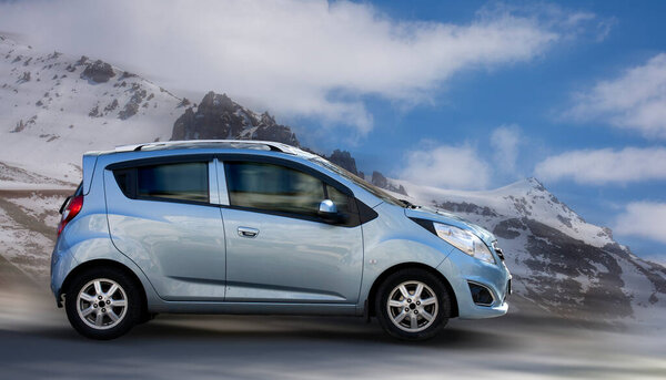 Passenger car on a motion blurred background.