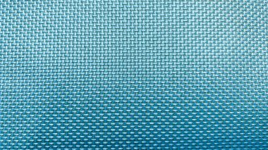 Mavi arkaplanda ipliklerden örülmüş minimalist doku