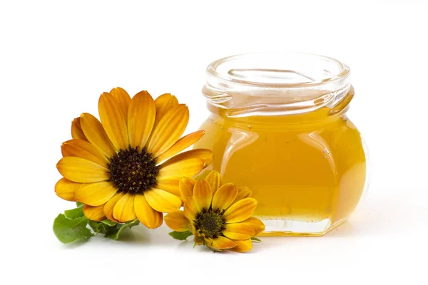 蜂蜜と花を背景に — ストック写真
