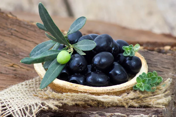 black olives and herbs in a bowl