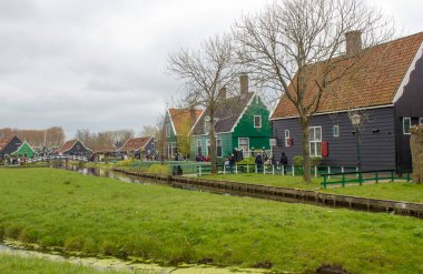 Traditional Houses in the Historic Village of Zaanse Schans on the Zaan River in the Netherlands clipart