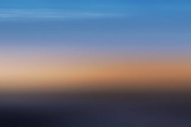 Bulanık gün batımı manzarası arkaplanı.