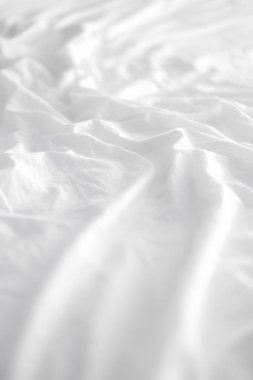 Arka plan için yumuşak beyaz kırışık yatak çarşafları