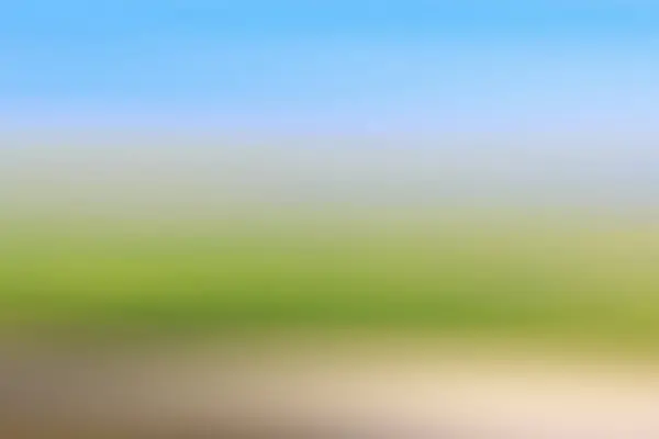 Abstract blurred blue sky, meadow and ground background. Golf course concept.