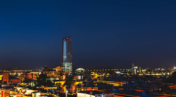 Pelli Tower at night. View from the traditional neighborhood of Triana in Seville, Spain.