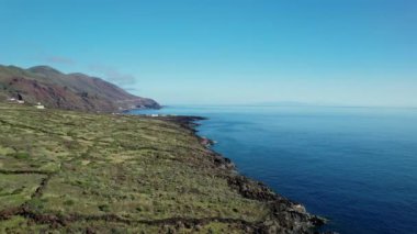 A Drone shot of a volcanic coast with blue sea. El Hierro, Canary Islands.