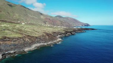 Drone shot of a natural coastline with volcanic landscape and blue Ocean on El Hierro Canary islands. Alternative traveling.
