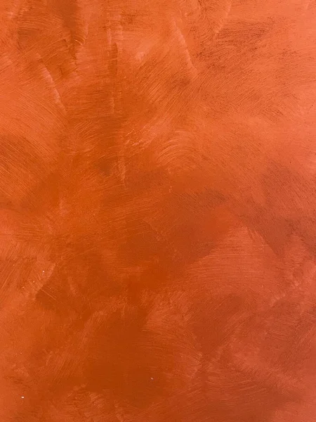 Wall background stained in shades of red