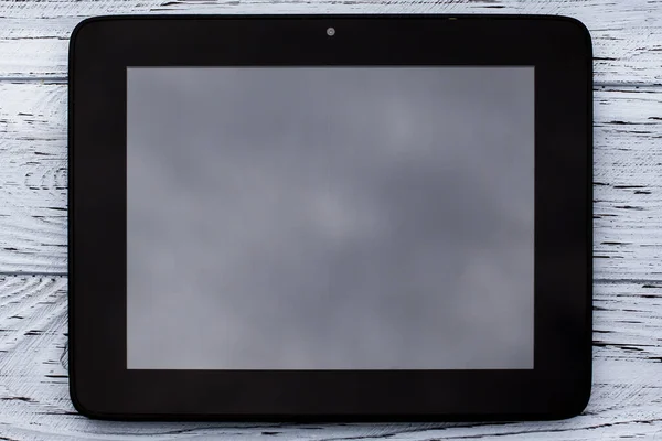 Black Tablet Blank Display Image Lies Light Wooden Textured Surface — Stok fotoğraf