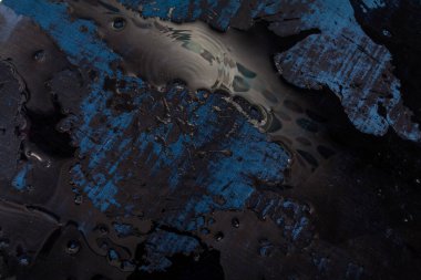 Blue textured fabric lies underwater. Abstract image with beautiful highlights for your creative design or stylish illustrations.