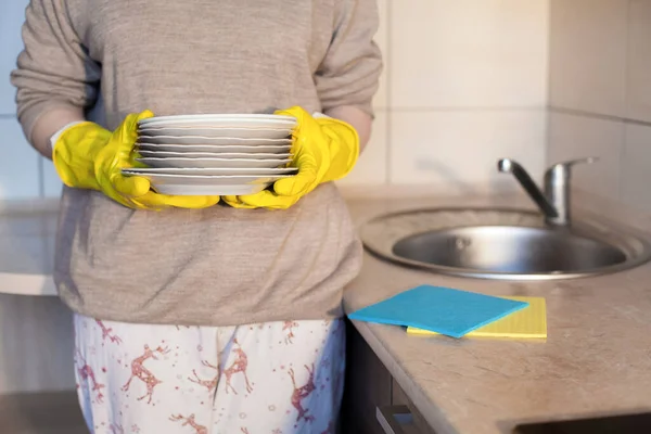 Young Girl Yellow Rubber Gloves Holds Clean Plates Her Hands — Stock Photo, Image