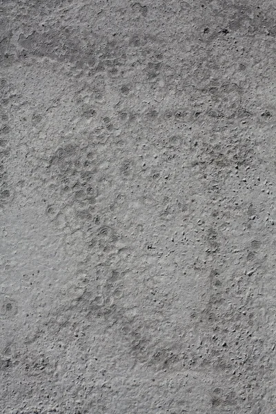 Kum kaplama çimento kirli yüzey dokusu, arka plan için eski gri beton duvar pürüzlü lekeler ve küçük delikler.