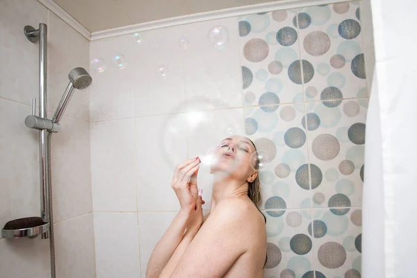 Playful Sexy Girl Blond Hair Blows Soap Bubbles Bathroom Laughs — Stock Photo, Image