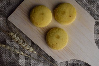 Nextar biscuits with pineapple flavor on a wooden cutting board