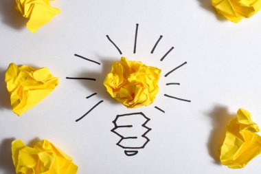 concept crumpled paper light bulb metaphor for good idea clipart