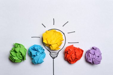 Creative flat lay composition with colorful paper balls on white background. Idea concept
