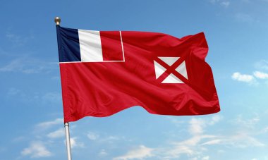 Wallis ve Futuna 'nın kırmızı bayrağı Fransız üç renkli ve beyaz haçı ile dalgalandırılıyor. Pasifik' teki Fransız denizaşırı topraklarını temsil ediyor.