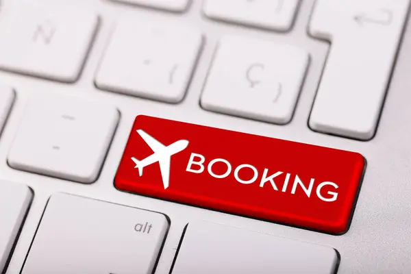 flight booking keyboard plane travel fly check buy website e-ticket key business concept - stock image