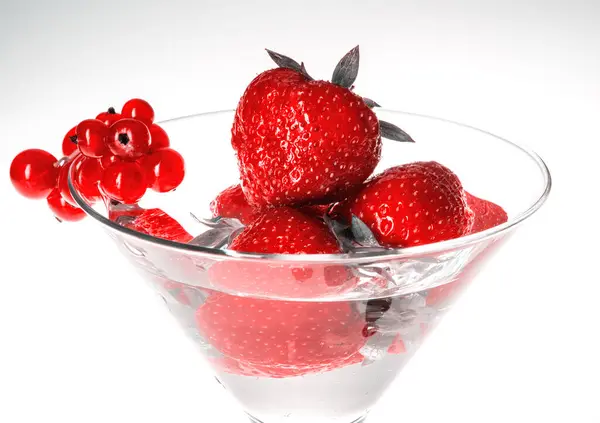 Strawberry in martini glass isolated on white background