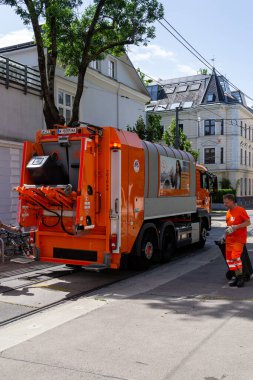 Vienna, Austria - 23.06.2023: Public service employees clean up garbage in the city