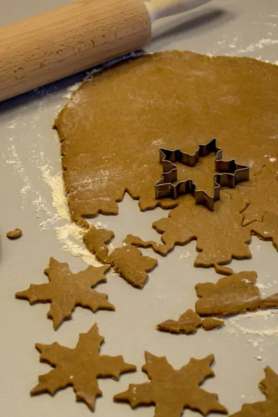 Cut out star cookies from rolled out dough before baking