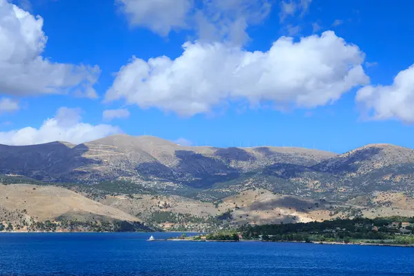 stock image Typical coast of Kefalonia in the bay of Argostoli in Greece. In the distance the Lighthouse of Saints Theodore. 