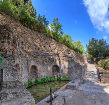 View of the Nymphaeum of  Mirrors among ancient Roman ruins on the northern slopes of the Palatine Hill in Rome, Italy. clipart