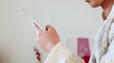 A woman who uses TikTok short videos at home