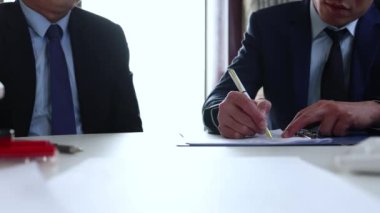 Leader and client sign on business contract document