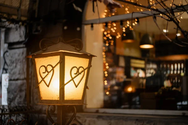 stock image Forged vintage lantern with a heart. New Year mood.