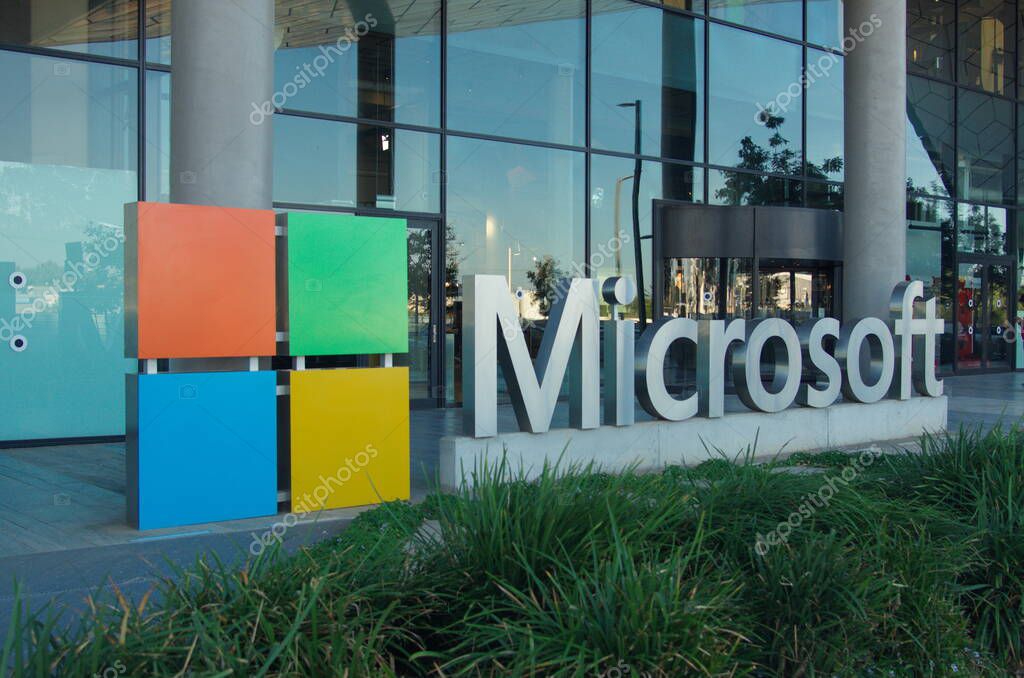 Israel Herzliya November 2022. Microsoft building. Modern hub made of glass and metal. Close-up company logo - capital letters . Entrance to the building.