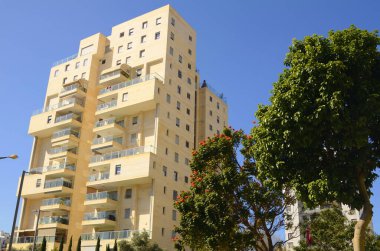 Bold architectural solutions. Modern residential buildings. The original design of the apartment building. Luxury real estate. Sale, rent of an apartment in a new building. Mortgage for a young family.