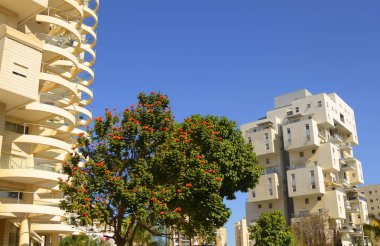 Bold architectural solutions. Modern residential buildings. The original design of the apartment building. Luxury real estate. Sale, rent of an apartment in a new building. Mortgage for a young family.