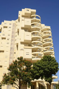 Bold architectural solutions. Modern residential buildings. The original design of the apartment building. Luxury real estate. Sale, rent of an apartment in a new building. Mortgage for a young family.