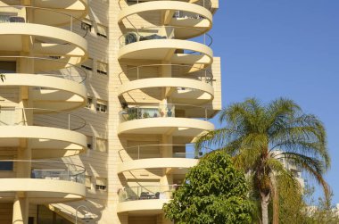 Bold architectural solutions. Modern residential buildings. The original design of the apartment building. Luxury real estate. Sale, rent of an apartment in a new building. Mortgage for a young family.