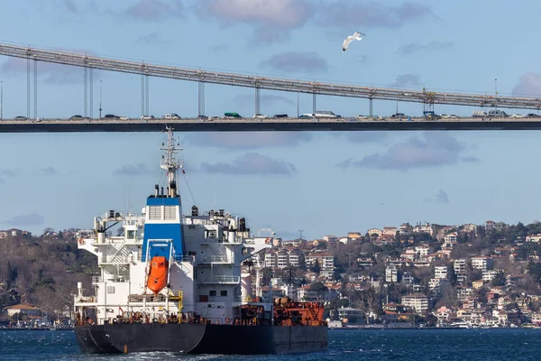 stock image Tanker ship pass through the Bosporus with Bosphorus Bridge in Istanbul, Turkey or Turkiye, Bosphorus strait connecting Europe to Asia, Tanker ship in Istanbul, Turkey.