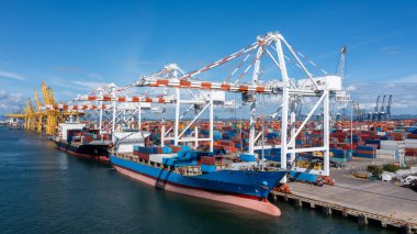 Aerial view container ship at commercial dock, Company import export  global business trade logistic and transportation by container cargo ship boat, Freight shipping maritime sea port terminal.