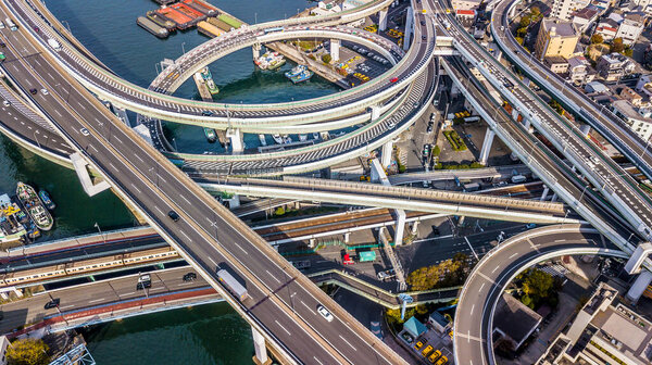 Aerial view highway and overpass Osaka City, Junctions of city highway vehicles drive on roads Osaka City, Japan, Highway interchange, Expressway important infrastructure, Osaka City, Japan.