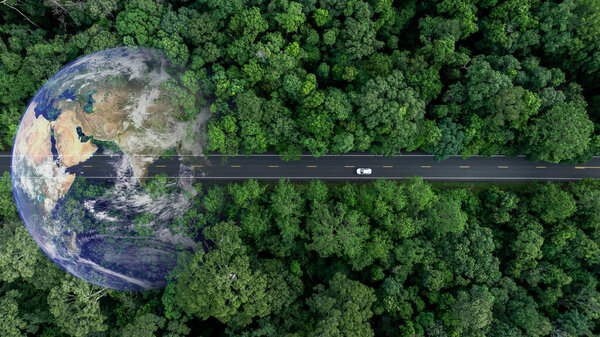 Aerial view EV electric vehicle car on middle green tree forest road globe earth planet, EV car electric vehicle car alternative sustainable energy eco power, Green business ecosystem environment.