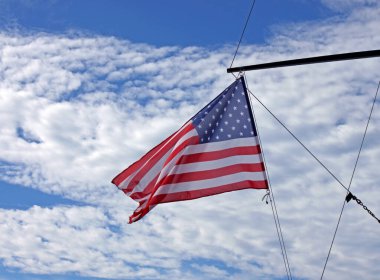 USA flag on yacht against cloudy sky in the Mediterranean Sea, Nice, France