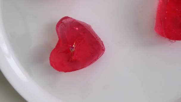 Valentine Setup Red Heart Shaped Jelly Piece Containing Golden Rings — Stockvideo