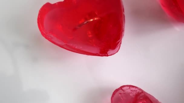 Valentine Setup Red Heart Shaped Jelly Pieces Containing Golden Rings — Vídeos de Stock