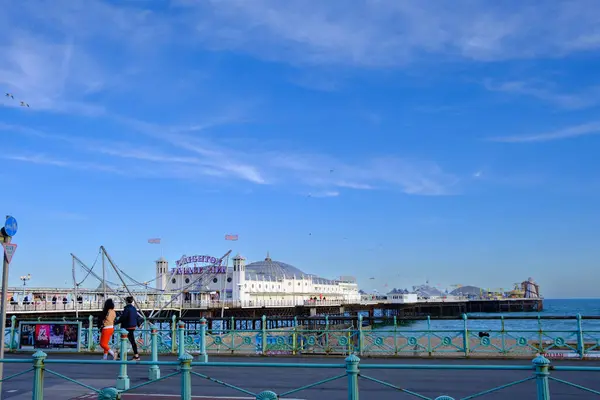 stock image Brighton, UK - May 3, 2024: Brighton beachfront with Palace Pier in the distance in East Sussex, England, United Kingdom