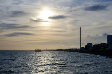 Brighton seaside at dusk in Sussex, United Kingdom clipart